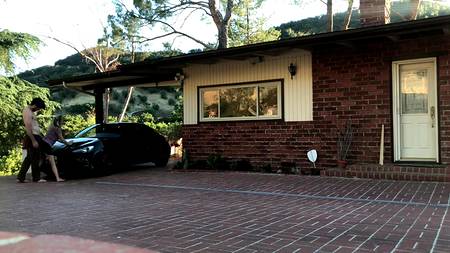 Наклонившаяся раком подруга дает себя драть возле спортивного автомобиля